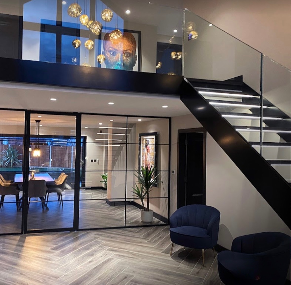 Luxury full property refurbishment in Liverpool — open plan interior with floating staircase and glass railings