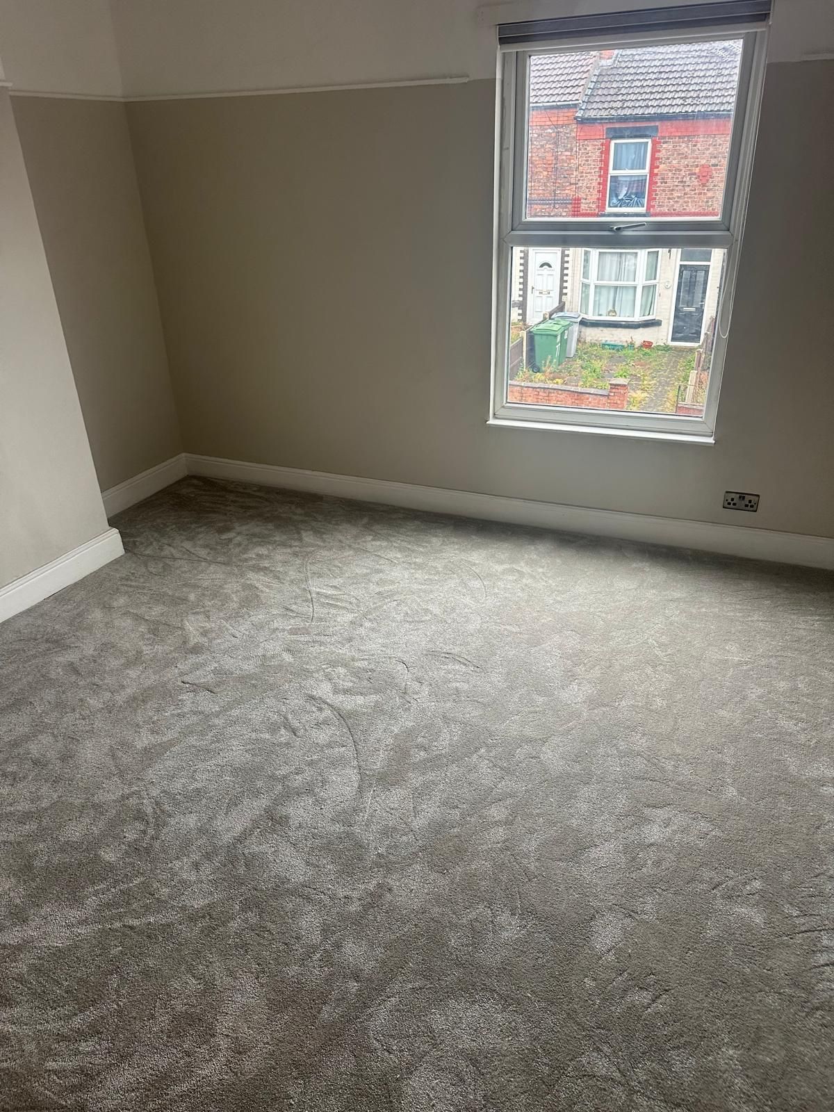 Front bedroom with new grey carpet and fresh decoration
